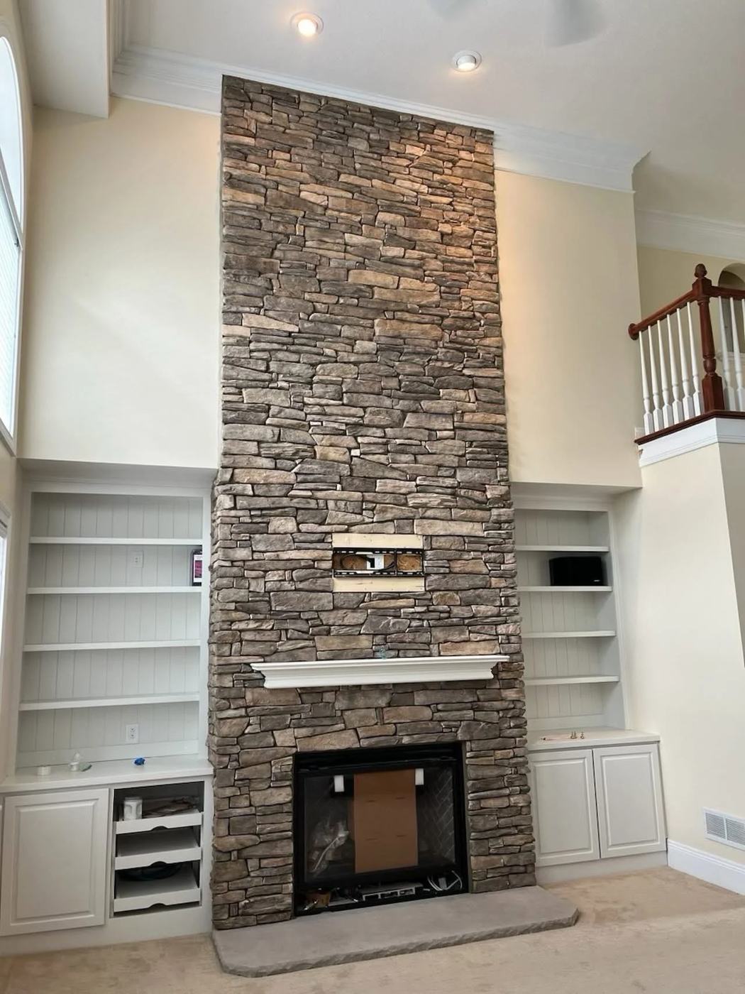 Interior stone chimney breast in a living room