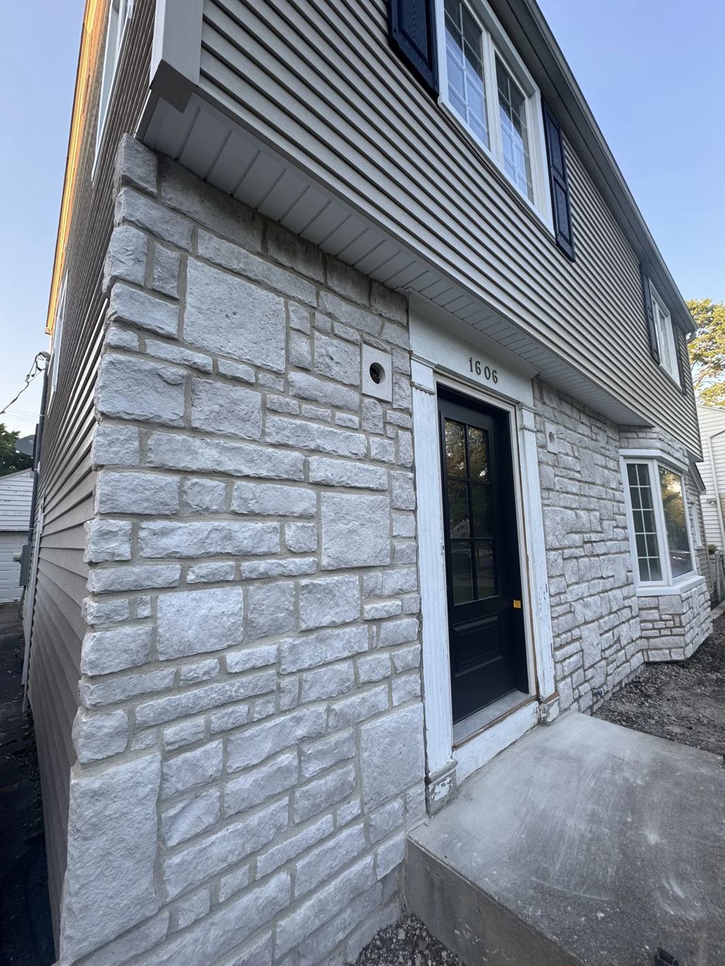 Stone veneer wrapping the corner of a home