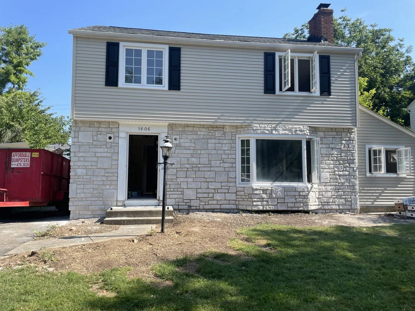Front elevation refaced in stone veneer