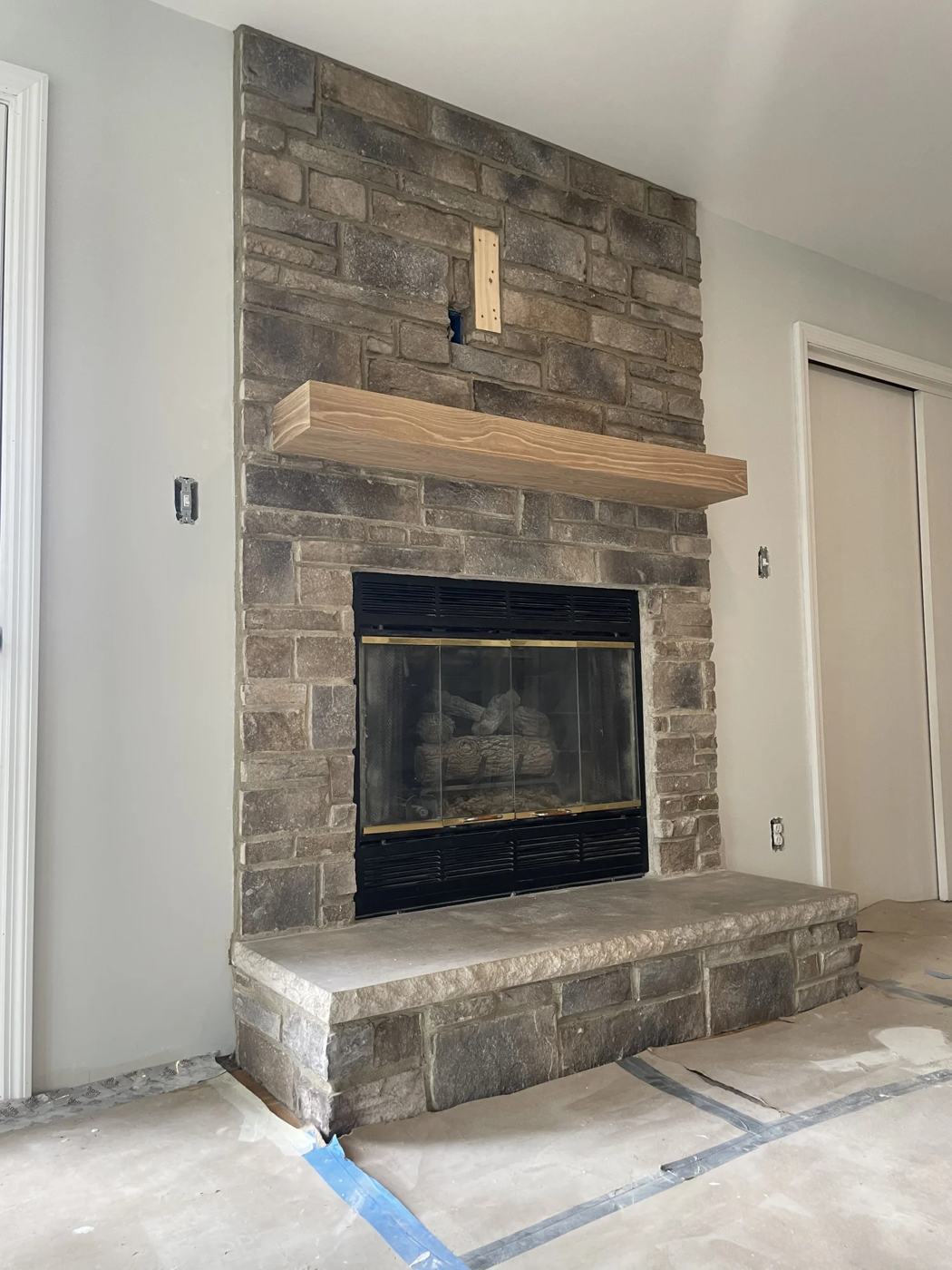 Stone fireplace with a raised stone hearth