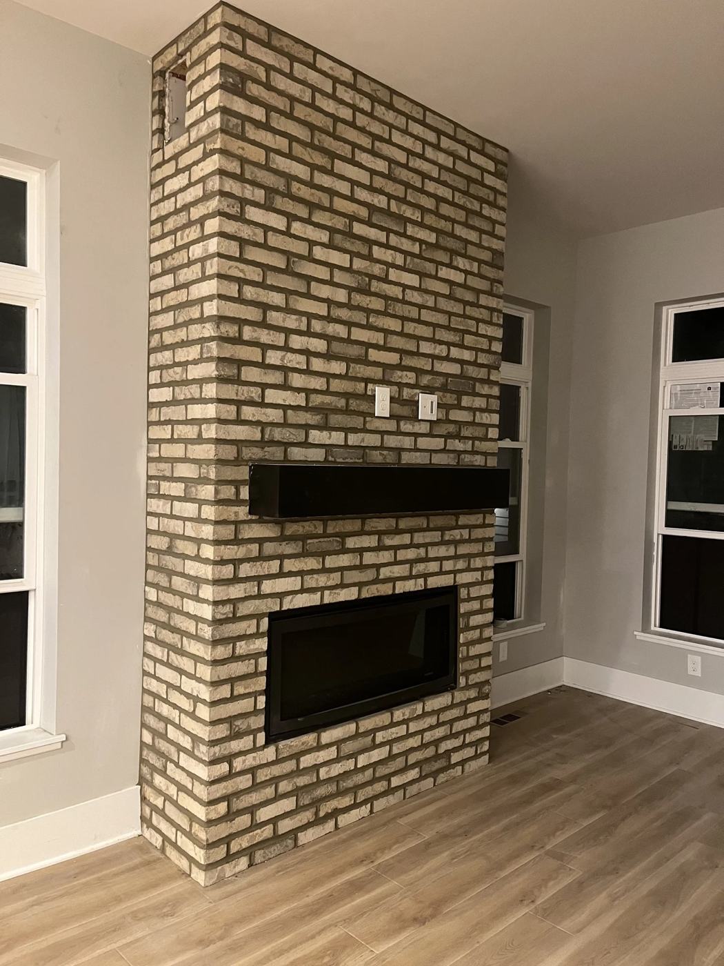 Modern brick fireplace with a linear firebox